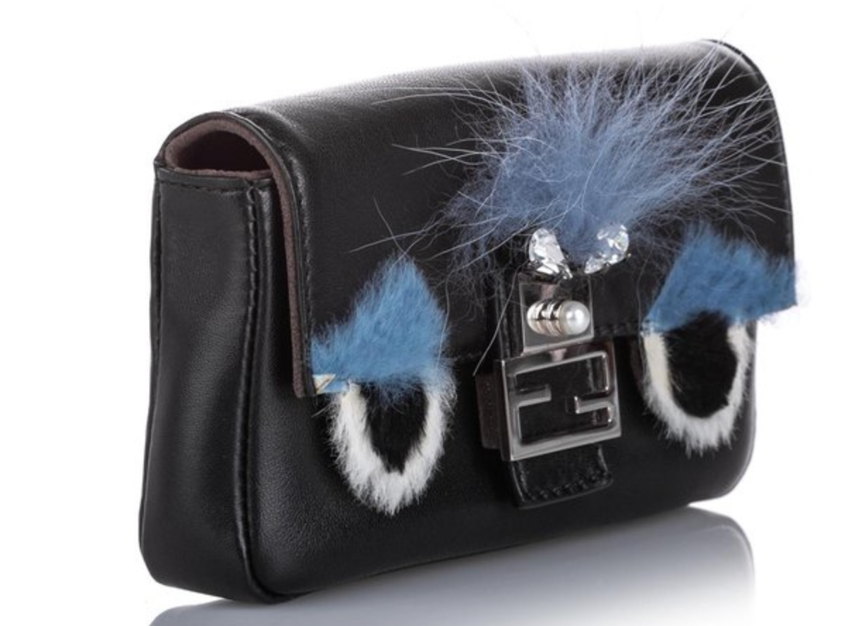 Finally, a side view highlights the compact, stylish design of the Fendi Black Monster Bag, ideal for any occasion.
