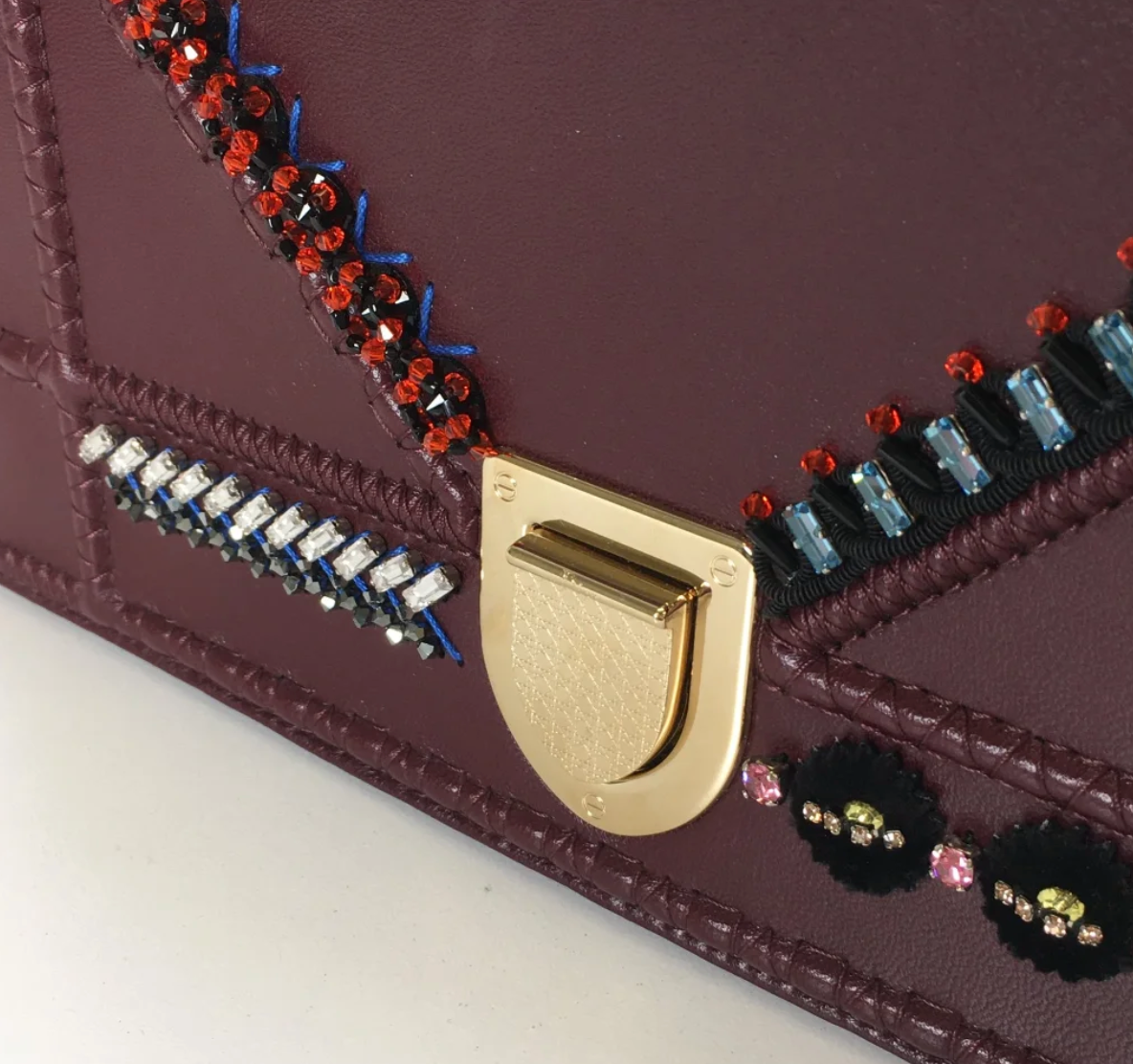 Side profile of Dior Diorama crossbody bag with metallic chain strap