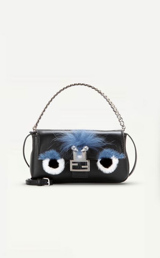 First, a front view of the Fendi Micro Black Baguette 'Monster' Bag shows the unique monster design with silver hardware.