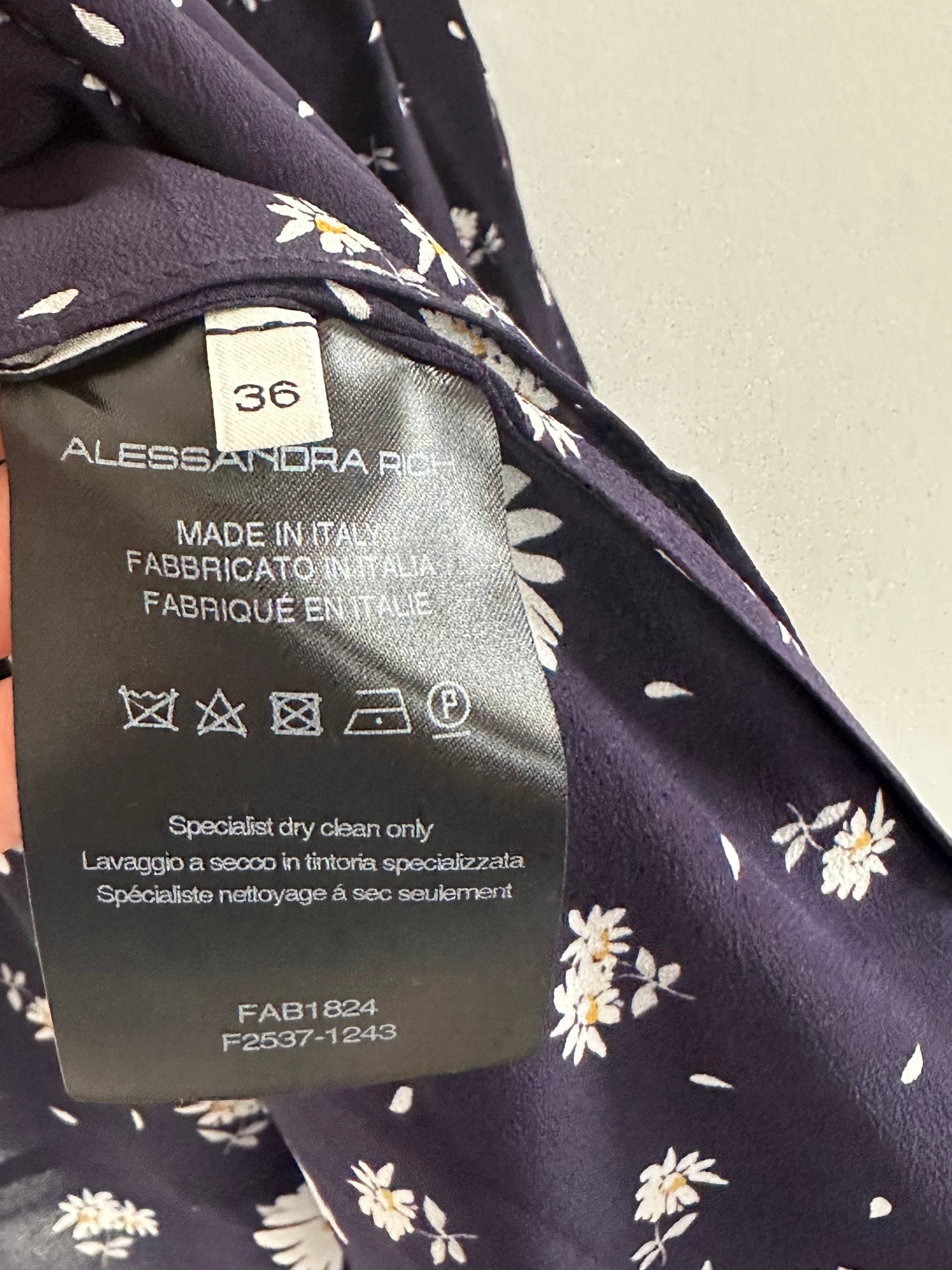 Next, a close-up captures the lightweight 100% silk fabric for a soft, luxurious feel.