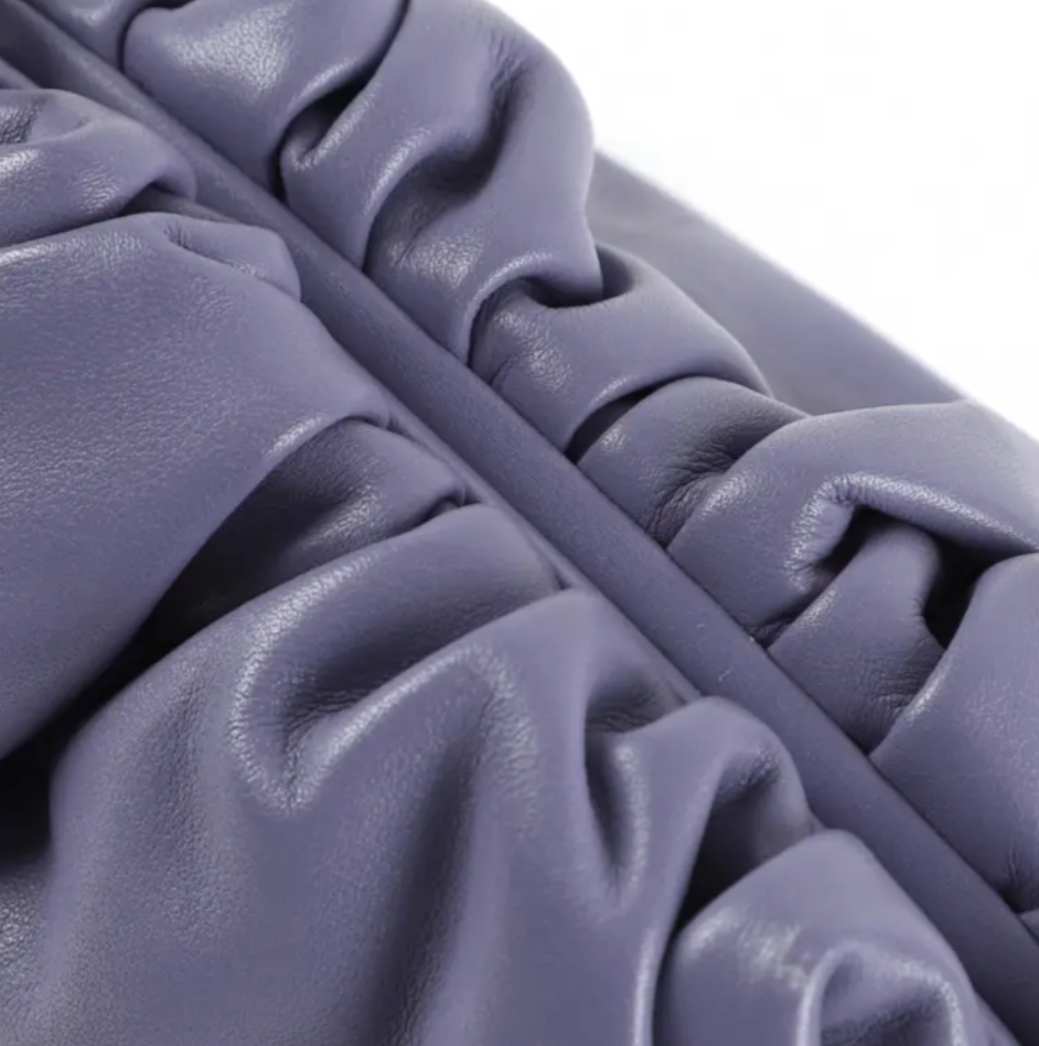 Close-up of Bottega Veneta pouch zipper and stitching